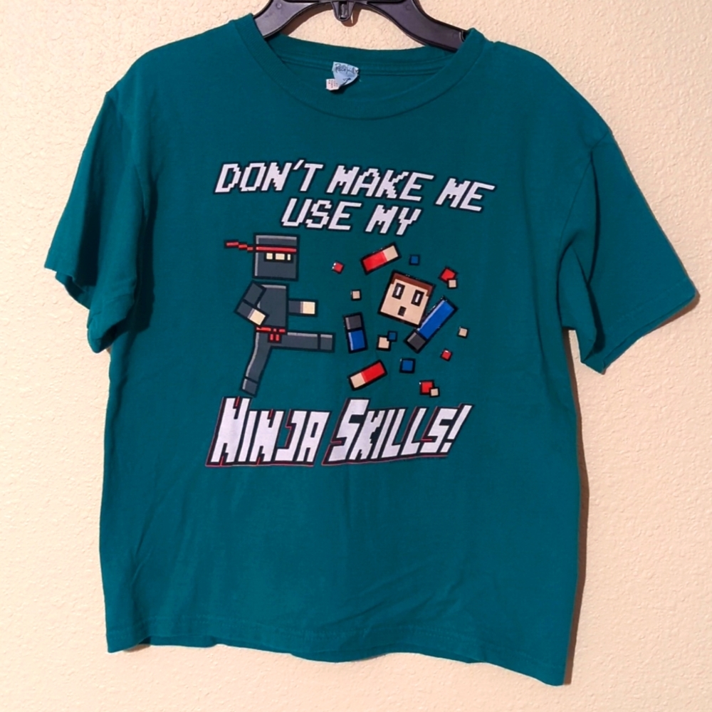 Boy's Green Ninja T-shirt. Size Medium. Good Condition.